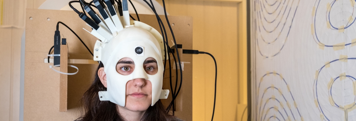 Lady wearing a brain scanner